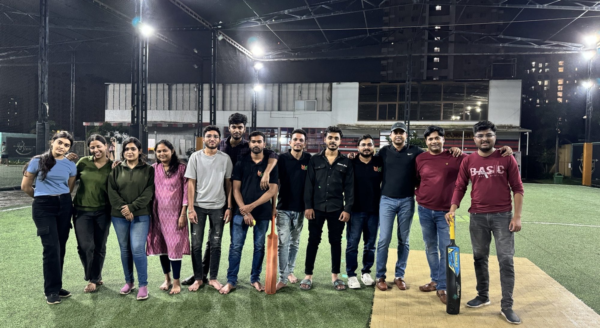 The GladOwl team on the turf at night